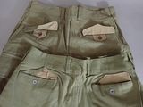 pair of khaki pants with buttons on the side of the pants