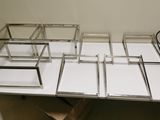 a white table with a bunch of glass boxes on it