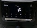 an air fryer that has a digital clock on it
