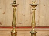 pair of antique brass candlesticks in the style of louis xvi