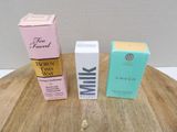 two boxes of milk sitting on a table next to each other