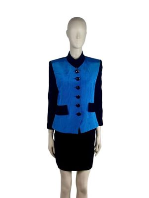 a mannequin wearing a blue jacket and black skirt