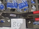 a bunch of tools in a case with a price tag on it