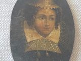 portrait of a young girl in a black dress with a gold collar around her neck