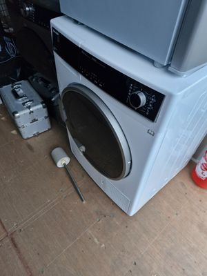 an image of a washing machine and a dryer on the floor