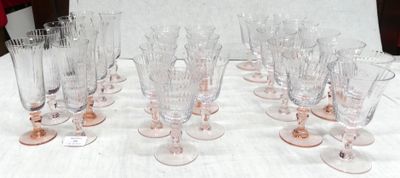 a lot of wine glasses sitting on a table