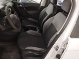 the interior of a white car with black seats and a steering wheel