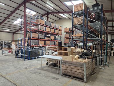 a large warehouse filled with lots of shelves and pallets