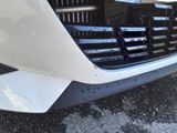 a close up of a car ' s front bumper and grille