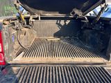 the back end of a pickup truck with its bed open