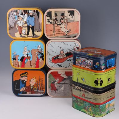 several tinned tinned containers with cartoon characters are stacked on top of each other