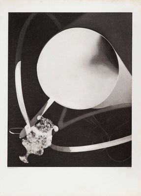 an old black and white photo of a vase with a flower in it