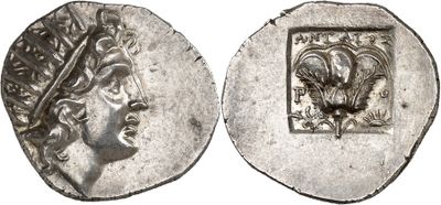 a silver coin with an image of a woman on it