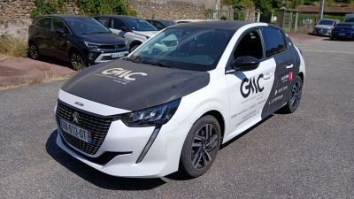 a white and black car parked on the side of the road
