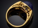 an image of a gold ring with a lapis stone in the center