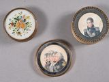 three miniature portraits of people are displayed in a gold frame
