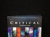 a box of critical foundation books on a black background