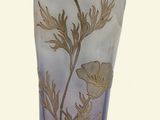 a glass vase with a floral design on it