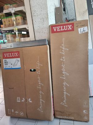two boxes sitting on the floor next to each other