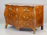 an antique chest of drawers with marble top and brass handles