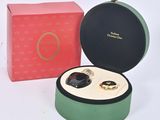 a box with two rings in it and a box with a ring in it