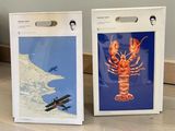 two pictures of a lobster and a plane on the table