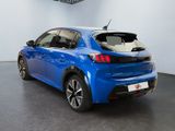 the rear end of a blue car in a showroom
