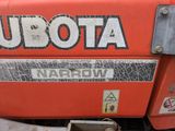 a close up of a red tractor with the word udota on it