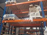many shelves with boxes and boxes on them in a warehouse