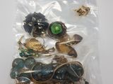 a bag of assorted jewelry sitting on a table