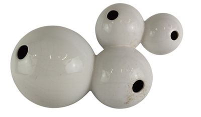 three white balls with black spots on them