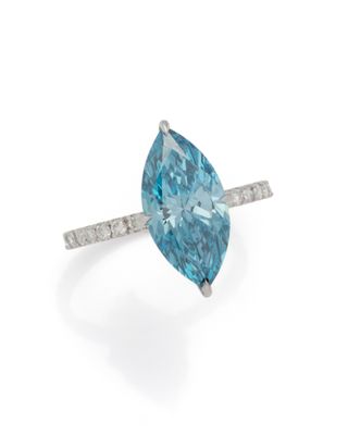 a blue diamond and diamond ring