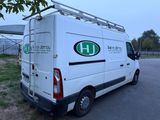 a white van that is parked on the side of the road