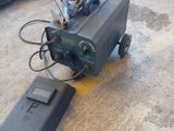 a machine that is sitting on the floor in the garage