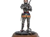 une figurine représentant un chevalier tenant une épée, posée sur un socle en bois
