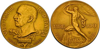 a close up of a gold coin with a man on it