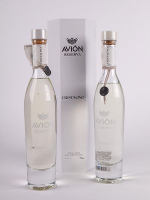 an image of a bottle of vodka next to a box