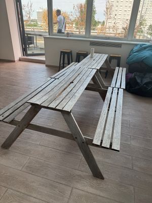 a wooden bench in the middle of a living room