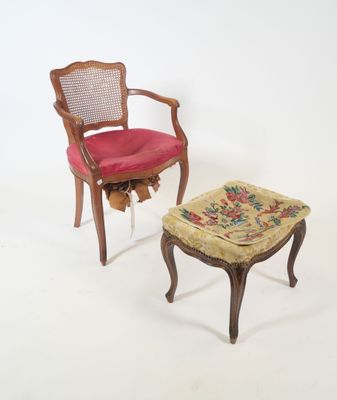 two chairs and a foot stool on a white surface