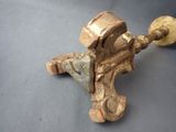 a small brass object that is on a table