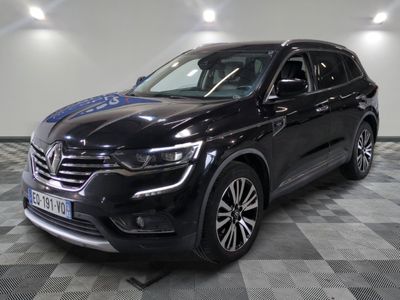 a black volkswagen suv is parked in a large room
