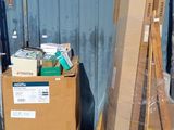 a stack of boxes sitting on a pallet in front of a building