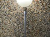 a lamp that is sitting on a table in a room