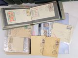 a lot of stamps and envelopes sitting on a table