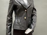 a mannequin wearing a black leather jacket and black pants