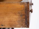 a close up of a drawer with a book on top of it