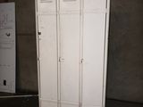 two white lockers that are in a room