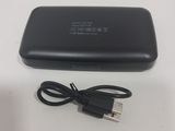 a black charger with a usb cable attached to it