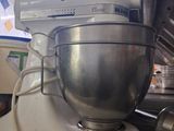a white mixer on a counter in a kitchen