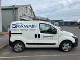 a white van that is parked in a parking lot